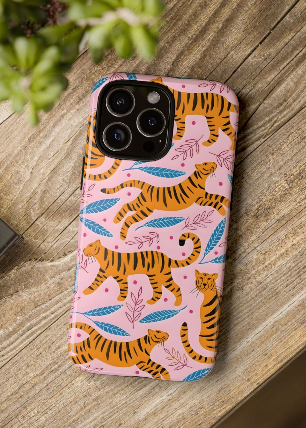 Phone case with tiger pattern on a wooden surface