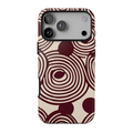 Retrograde iPhone case featuring oversized burgundy and cream concentric circles, abstract swirls, and a distressed 70s-inspired geometric pattern.