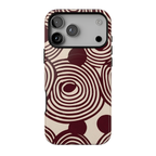 Retrograde protective MagSafe case featuring oversized burgundy and cream concentric circles, abstract swirls, and a distressed 70s-inspired geometric pattern.