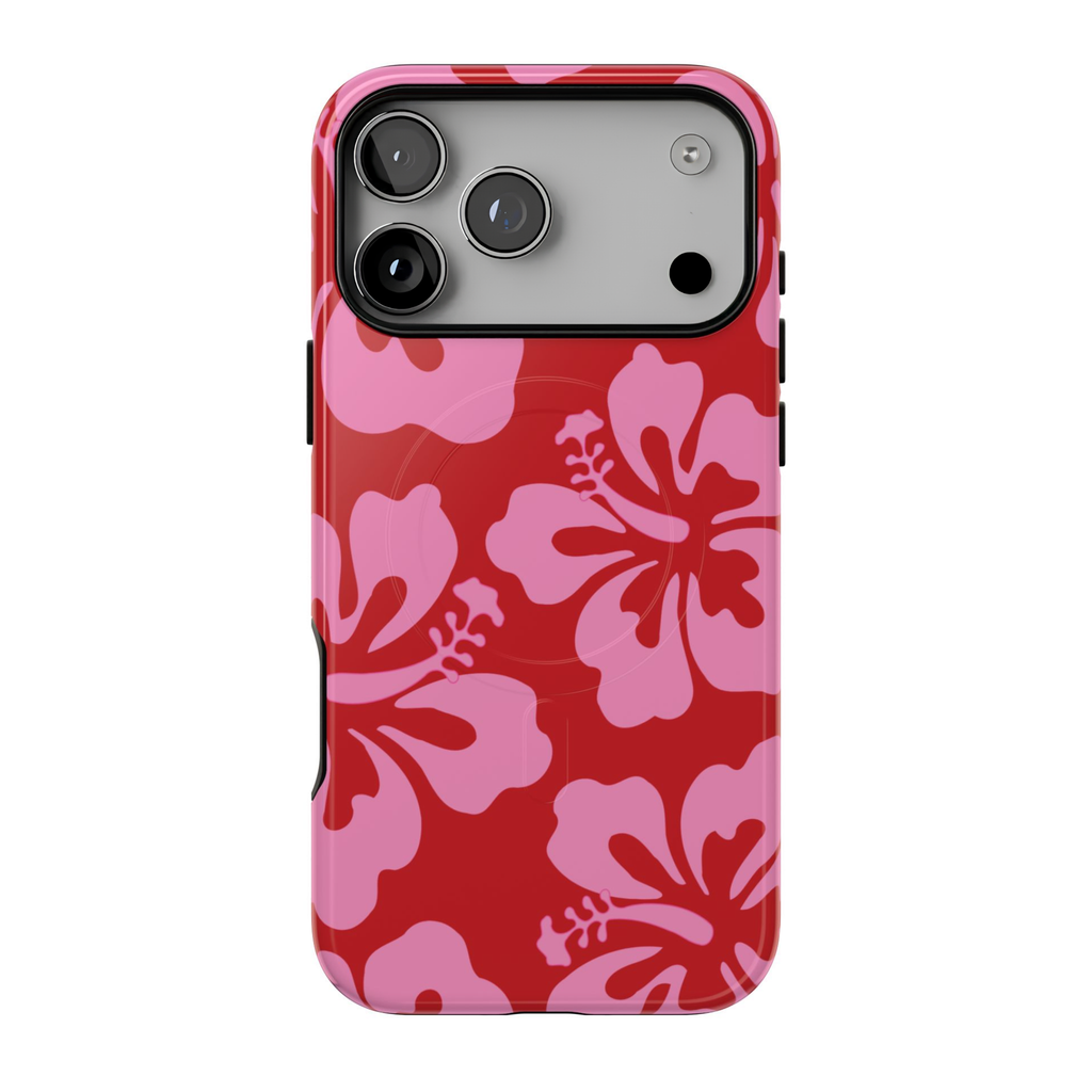 Island Vibe MagSafe iPhone case featuring oversized bubblegum pink hibiscus flowers on a vibrant cherry-red background with a retro Hawaiian tropical print.