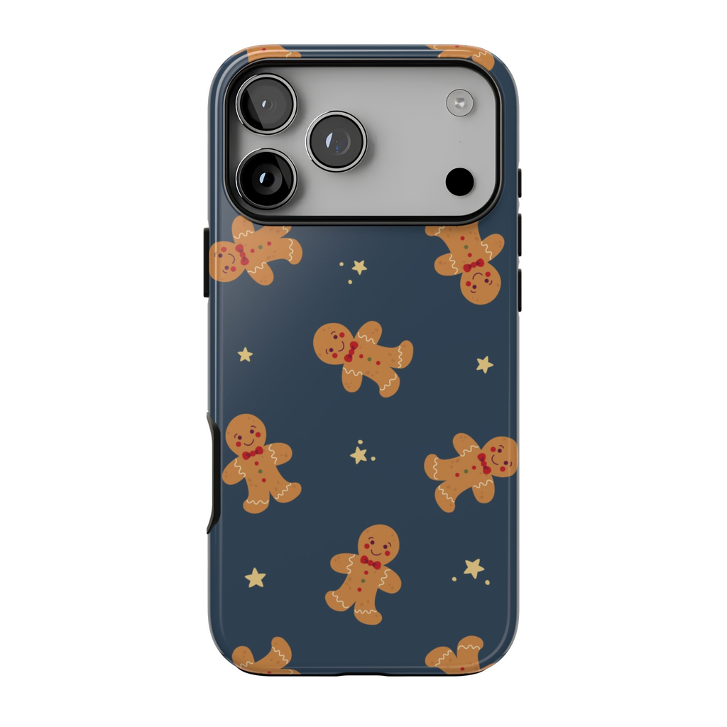 Gingerbread Dreams iPhone case featuring smiling gingerbread cookies and scattered golden stars on a deep navy blue background with a whimsical Christmas pattern.