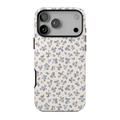 Love Notes iPhone case featuring tiny periwinkle blue flowers, delicate sage-green leaves, and a vintage-inspired ditsy floral pattern on an ivory background.