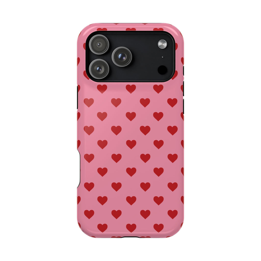 Phone case with red heart pattern on pink background