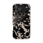 Phone case with a black and white cow print pattern on a white background